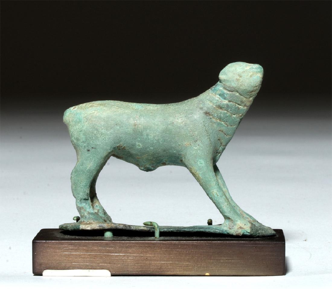Near-Miniature Greek Bronze Votive - Calf: **Originally Listed At $1500** Ancient Greece, ca. 5th to 4th century BCE. A near miniature ancient Greek bronze votive figurine depicting an animal, possibly a calf, upon an integrated base with outs