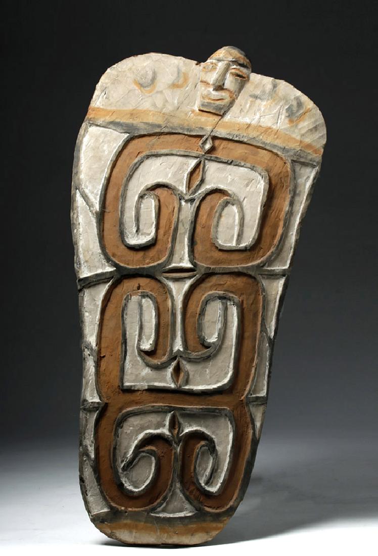 Mid-20th C. Indonesian Wood Asmat Painted Sago Dish: Indonesia, western Irian Jaya, Asmat people (who are closely related to people from Papua New Guinea), ca. mid 20th century CE. A softwood bowl in the form of a leaf sheath from the sago palm, with cu