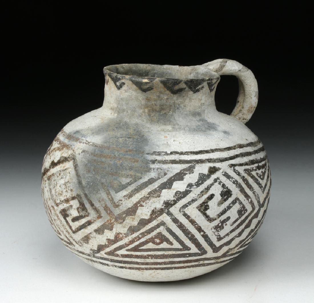 Mogollon Black on White Pottery Mug: North America, southwestern corner of New Mexico extending along Mogollon Rim into east-central and southeast Arizona, southward to Chihuahua region of northern Mexico, ca. 1100 to 1250 CE. A stunning