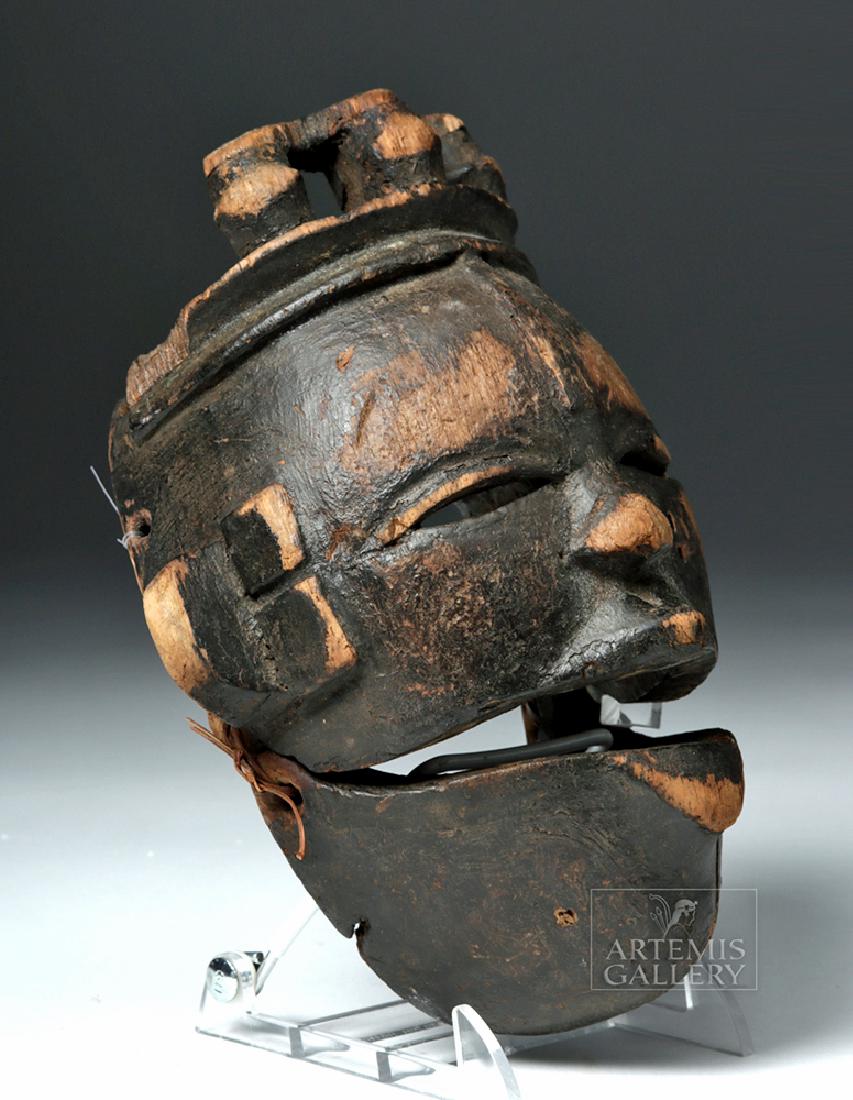 Early 20th C. Nigerian Ogoni Articulated Wood Mask: West Africa, Nigeria, Ogoni peoples, ca. early to mid-20th century CE. A well-aged example of a traditional cane wood Ogoni dance mask, with narrow eyes, an exaggerated nose, and articulated jaw which
