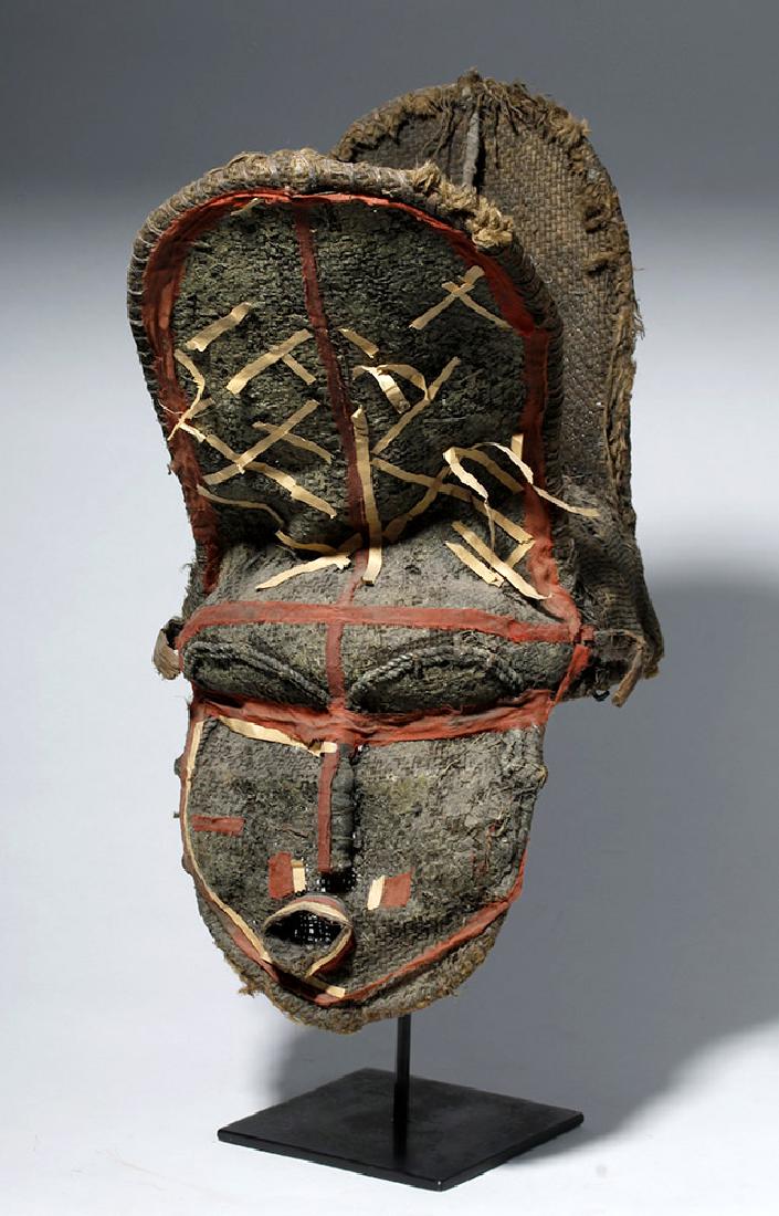 African Chokwe Male Dance Mask - Makishi Wa Chisaluke: Africa, Zambia / Angola / Democratic Republic of the Congo area, Lunda / Chokwe, ca. early 20th century CE. A Makishi Chisaluke mask comprised of burlap, vegetal fibers, branches, and decorations made