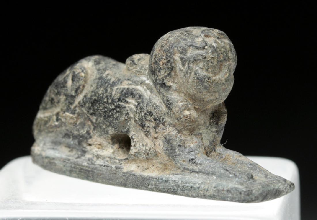 Rare Egyptian Steatite Amulet in Form of Sphinx: **Originally Listed At $150** Ancient Egypt, New Kingdom to Third Intermediate Period, ca. 1550 to 712 BCE. A fantastic black steatite amulet in the form of a sphinx. Beyond its most famous incarnatio