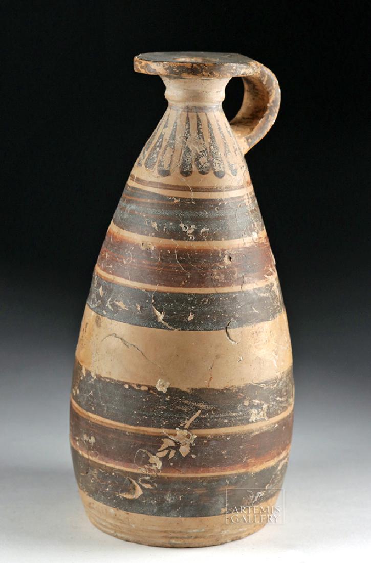 Etrusco-Corinthian Polychrome Alabastron: Etruria, northern Italy, Etrusco-Corinthian, ca. 630 to 540 BCE. A tall and slender polychrome alabastron - used for holding perfumes and scented oils - with a planar base and a piriform body that ris