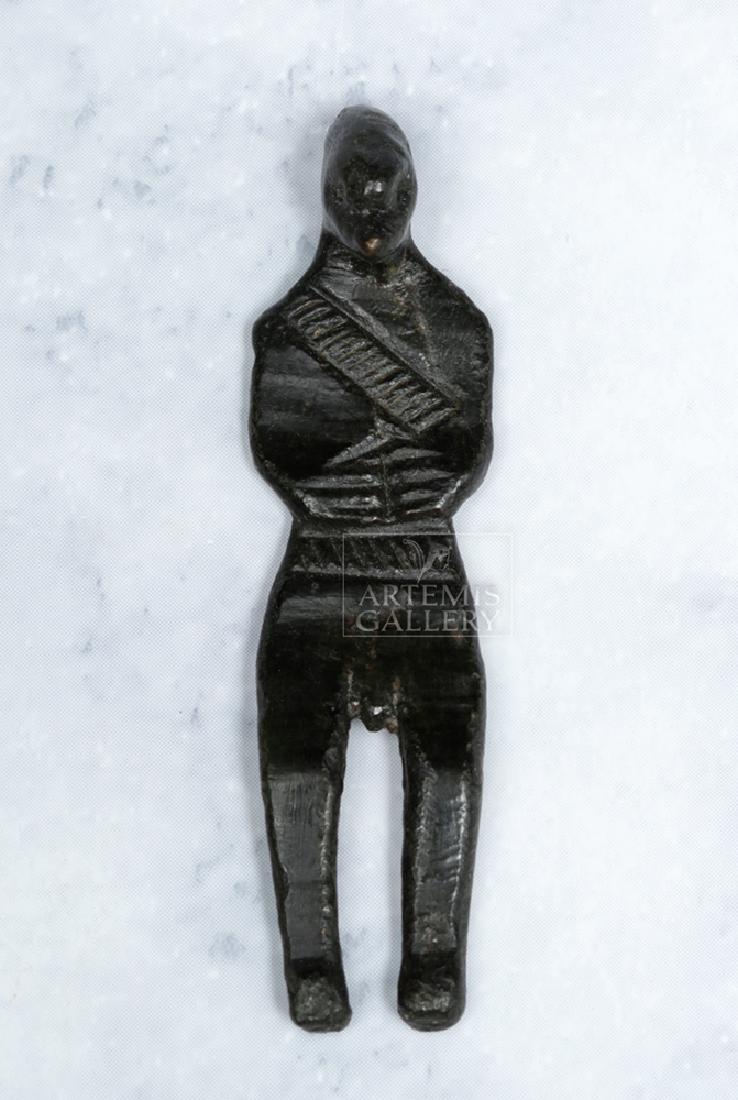 Rare Ancient Dagestan Bronze Standing Figure: Western / Central Asia, Caucasus Region, Dagestan, ca. mid 2nd to early 1st millennium BCE. An intriguingly-shaped, anthropomorphic idol made from cast bronze, with long legs, a strangely-shaped, almo