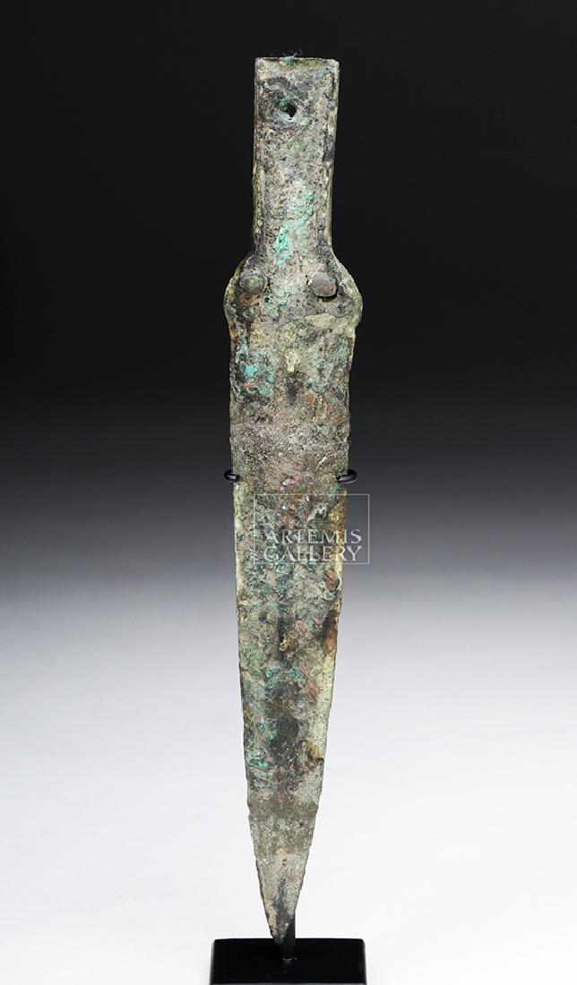 Ancient Balkan Bronze Dagger Blade: Classical World, Balkan Europe, ca. 4th to 1st century BCE. A fine cast-bronze dagger blade with a flared guard, a flanged handle area, and a slender blade with a shallow midrib. Inside the widened gu