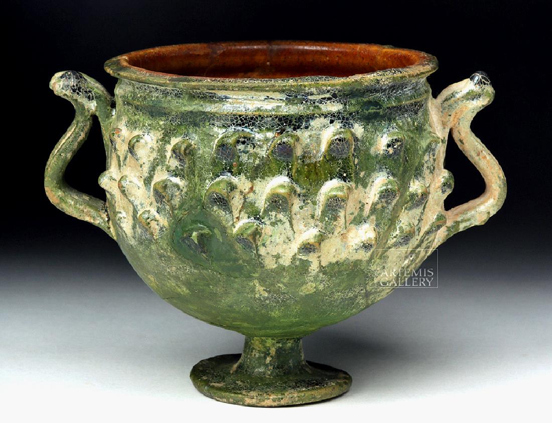 Roman Green Glazed Pottery Chalice Pinecone Scales: Roman, Imperial Period, ca. 1st century BCE to 1st century CE. A stunning glazed ceramic chalice with three rows of staggered pinecone scales (the pinecone motif perhaps referencing the cult of Dionys
