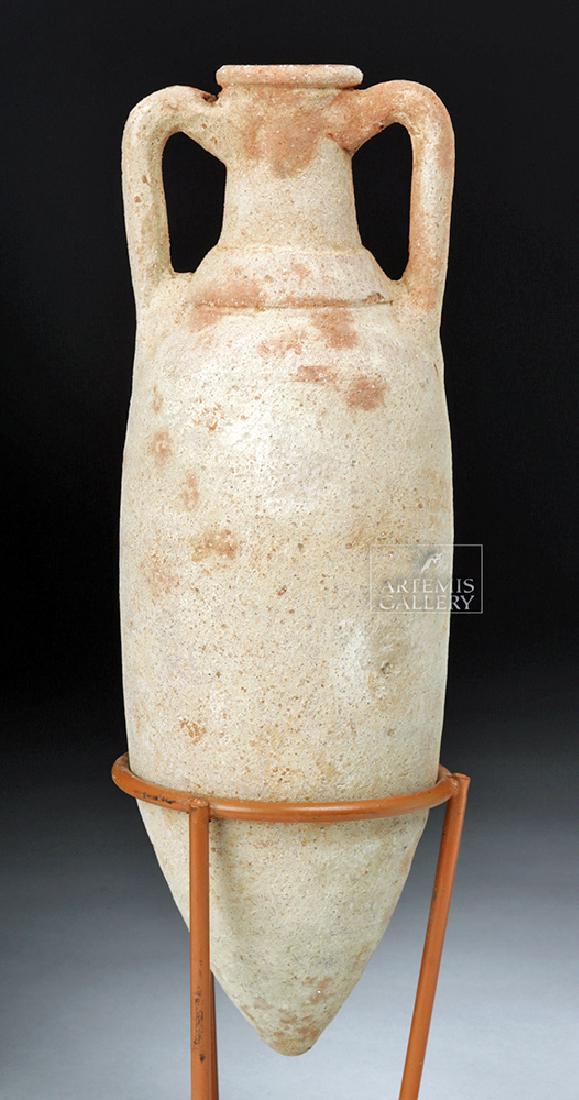 Roman Terracotta Table Top Amphora - Dressel Type 4: Roman, early Imperial Period, ca. late 1st century BCE to early 1st century CE. A petite terracotta table amphora resembling the classic Dressel Type 4 style. This miniature vessel is comprised of a c