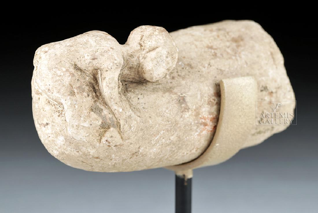 Egyptian Limestone Bes Erotic Sculpture, ex-Christie's: Ancient Egypt, Ptolemaic Period, ca. 305 to 30 BCE. A fascinating limestone sculpture of a diminutive male figure with his arms and legs wrapped around his towering phallus. This type of figure is som