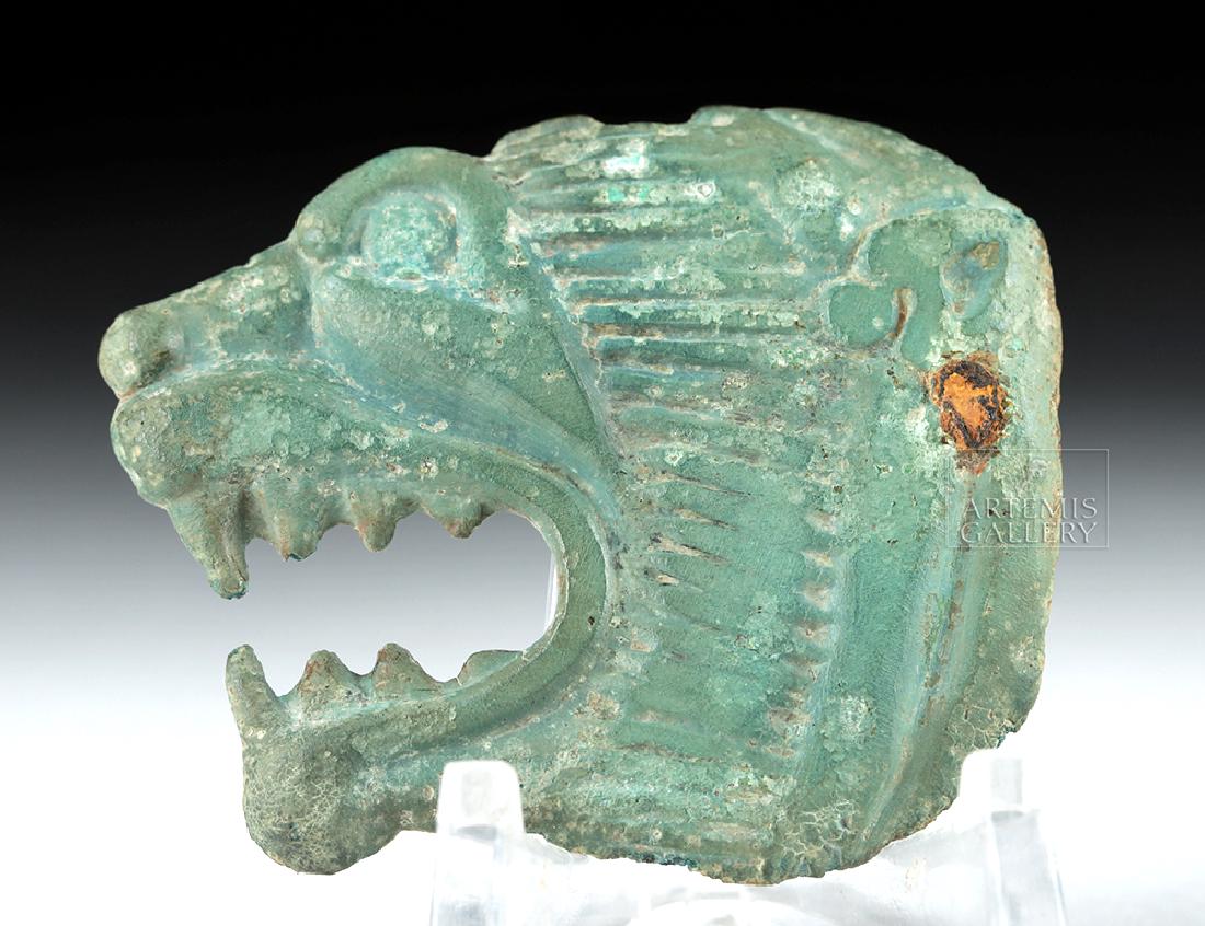 Achaemenid Bronze Applique - Lion's Head: Ancient Near East, Achaemenid Persian Empire, ca. 500 to 330 BCE. A snarling lion's head cast bronze applique or buckle, its decorated face replete with details. Two bronze studs (possibly once a hook