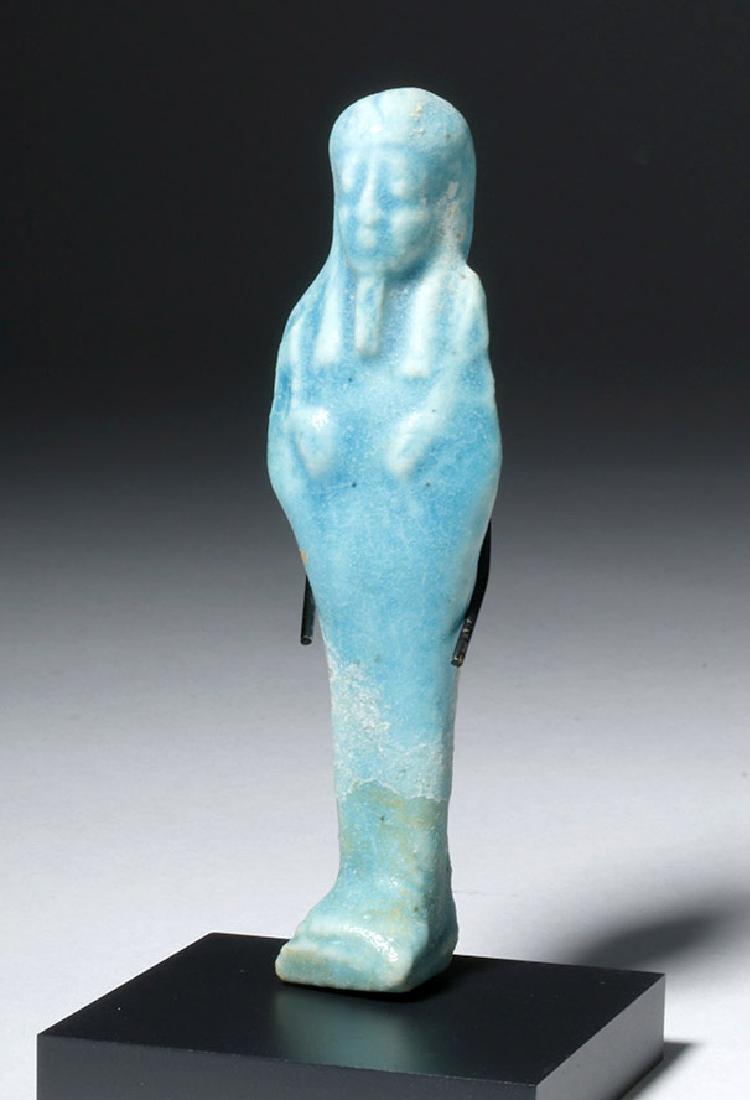 Egyptian Blue Glazed Faience Ushabti: **Originally Listed At $500** Egypt, Late Period, Dynasties 26 to 31, ca. 664 to 343 BCE. A beautiful standing mummiform ushabti figure in saturated aqua blue faience, waiting to do the work of the ne