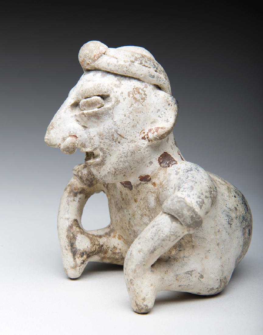 Jalisco Hunchback Seated Figure, White Slip: **Originally Listed At $500** Pre-Columbian, West Mexico, Jalisco culture, ca. 100 BCE - 250 CE. Hunch back solid pottery seated figure having a white slip surface with medium brown/red painted highli