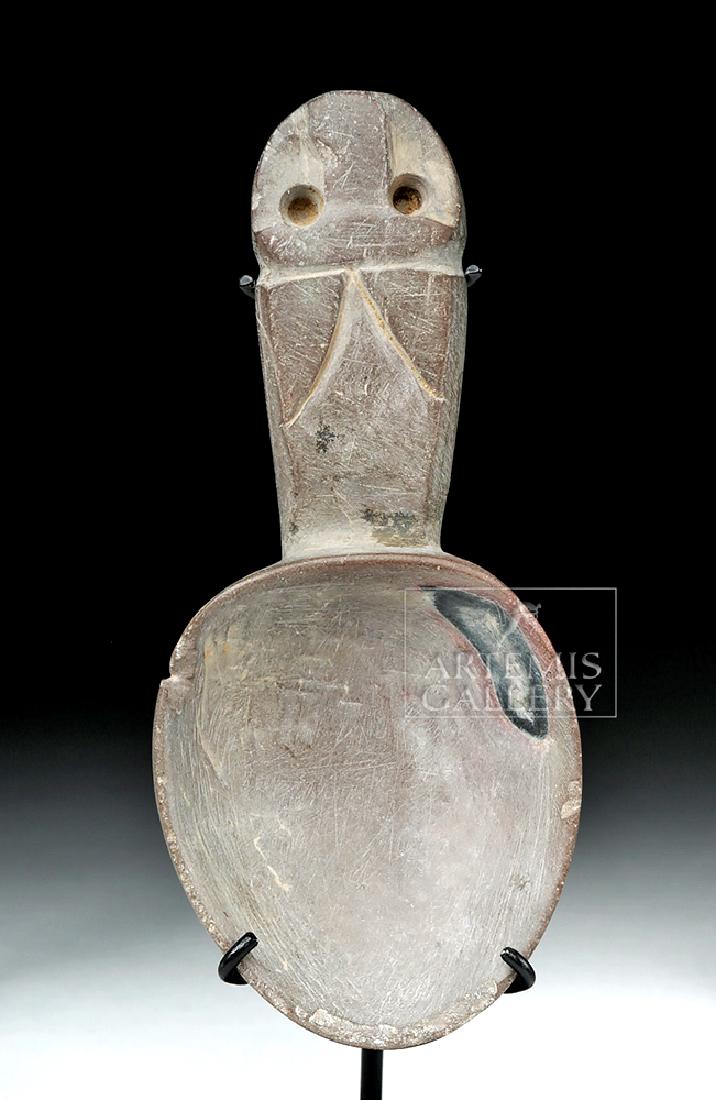 Chavin Stone Spoon with Jaguar: Pre-Columbian, Peru, Chavin, ca. 900 to 200 BCE. Hand-carved from a soapstone-like grey spoon with an abstract jaguar face on the end of the handle, this spoon was probably used in the preparation of