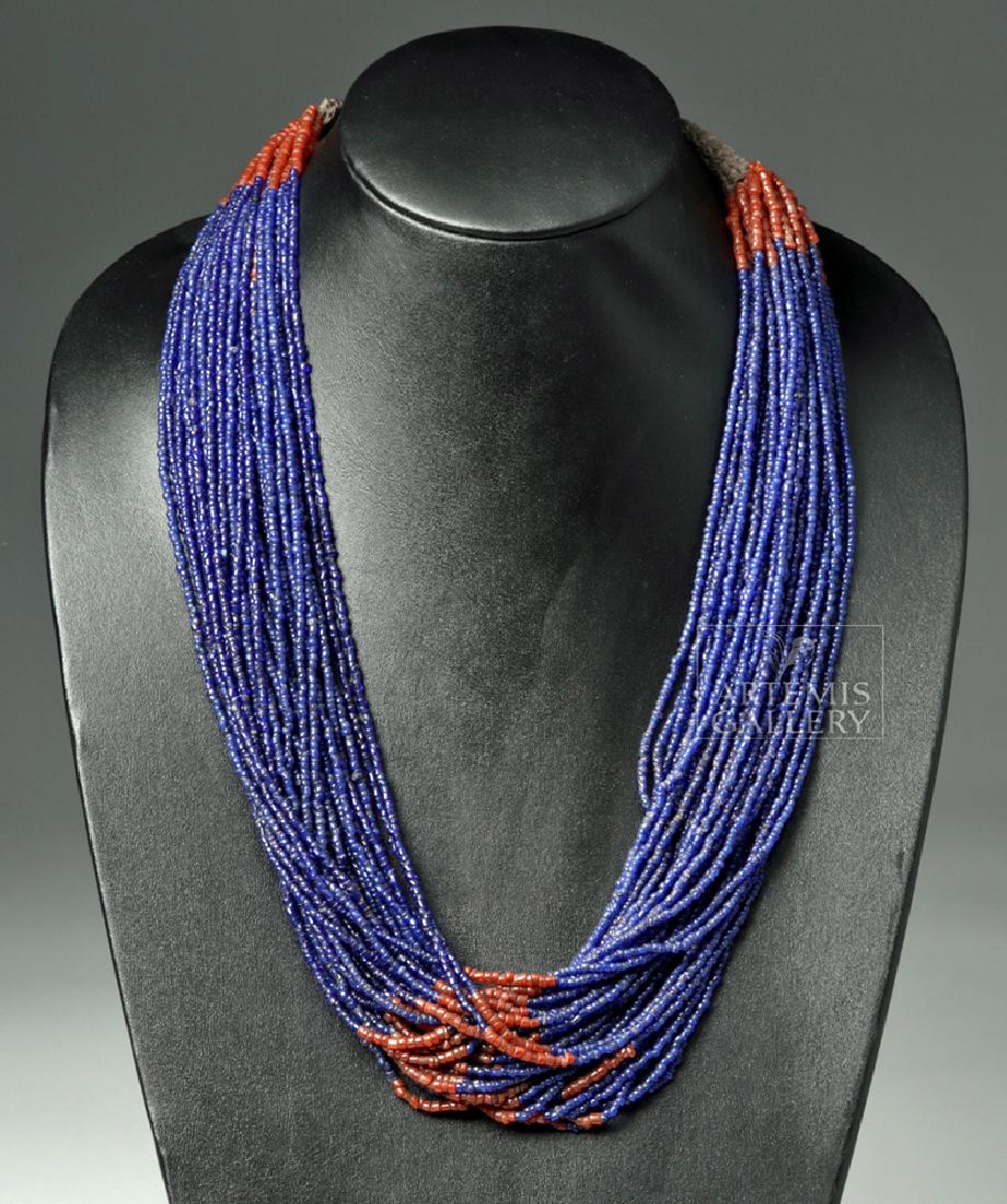 Early 20th C. Naga Multi-Strand Glass Bead Necklace: Central Asia, India, Naga peoples, ca. early to mid 20th century CE. A gorgeous glass bead necklace made by the Naga culture composed of thirty-four strands of hundreds of blue and red glass seed bead