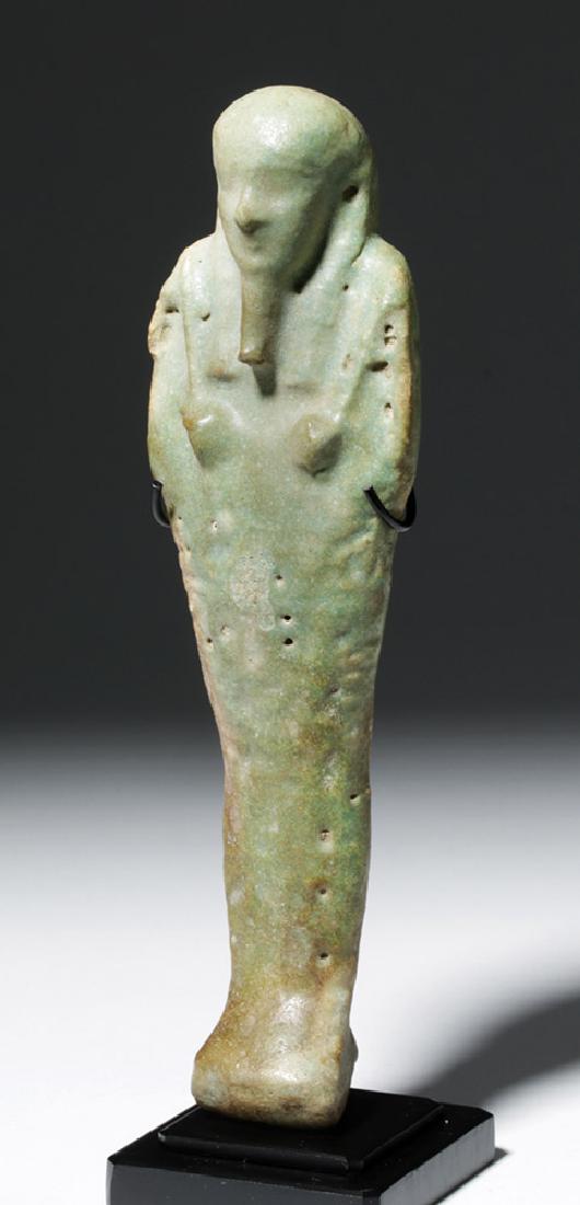Egyptian Late Periof Faience Ushabti: **Originally Listed At $700** Egypt, Third Intermediate Period, ca. 1070 to 712 BCE. Painted with a turquoise faience that turns pale brown towards the feet. It is mold-made, mummiform, with wonderful
