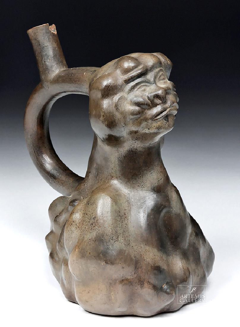 Published Moche Blackware Vessel - Human / Vegetal: **Originally Listed At $900** Pre-Columbian, Peru, Moche III, ca. 400 to 500 CE. A fascinating burnished blackware stirrup spout collage vessel showing a gun metal finish resulting from reduction firi