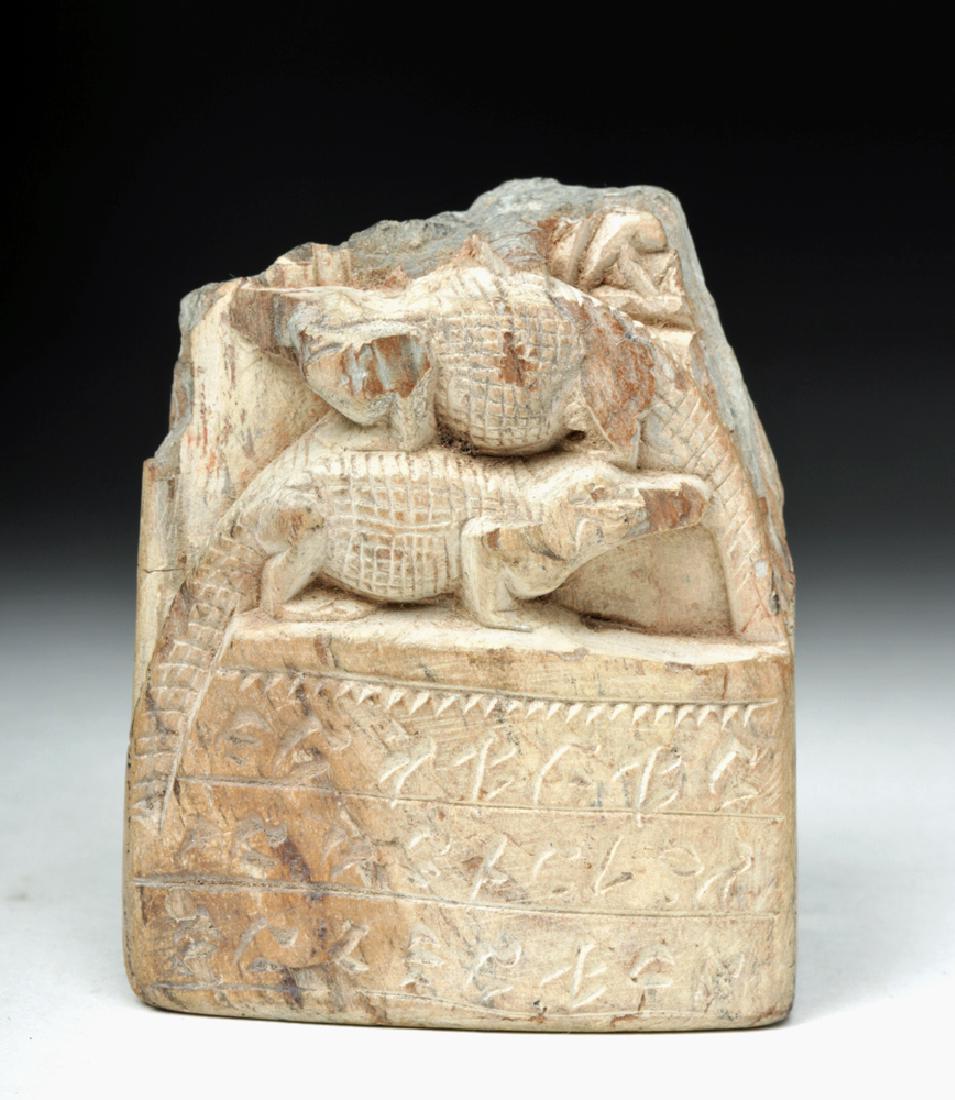 Egyptian Late Dynastic Carved Stone Cippus: **Originally Listed At $1000** Ancient Egypt, Late Dynastic period, ca. 712 to 332 BCE. A carved stone panel cippus, a votive plaque which once would have depicted the god Horus standing atop the two