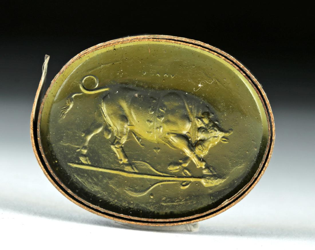 18th C. Neoclassical Glass Intaglio - Fierce Bull: Northern Europe, Neoclassical period, ca. 18th to early 19th century CE. A handsome dark yellow glass intaglio featuring a fierce bull ready to charge, its head down, its front legs pawing at the eart