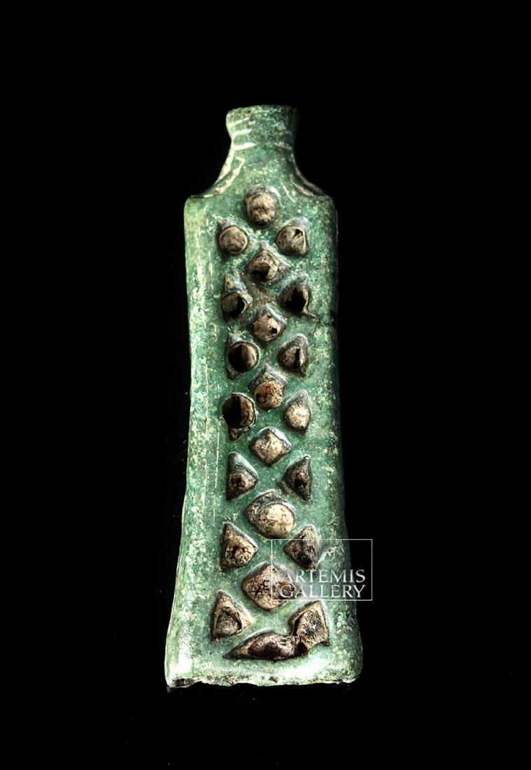 Viking Bronze Needle Case: **First Time At Auction** Northern Europe, Viking / Norse culture, ca. 800 to 1100 CE. A pretty cast bronze needle case, openwork and in the form of a flattened bottle. The sides have open hatching. T
