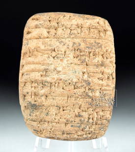 Translated Mesopotamian Clay Tablet, ex-Bonhams: Ancient Near East, Sumer, Third Dynasty of Ur, ca. 2080 to 2030 BCE. A clay tablet of a rectangular form with rounded sides, smooth faces, and a planar top and bottom. The tablet bears seventeen uneve