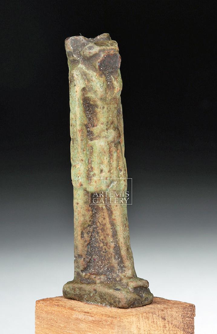 Egyptian Faience Amulet of Striding Sekhmet: **Originally Listed At $200** Egypt, Third Intermediate to Late Dynastic Period, 21st to 31st Dynasty, ca. 1069 to 332 BCE. A standing green-glazed faience figural amulet of Sekhmet, the lioness-heade