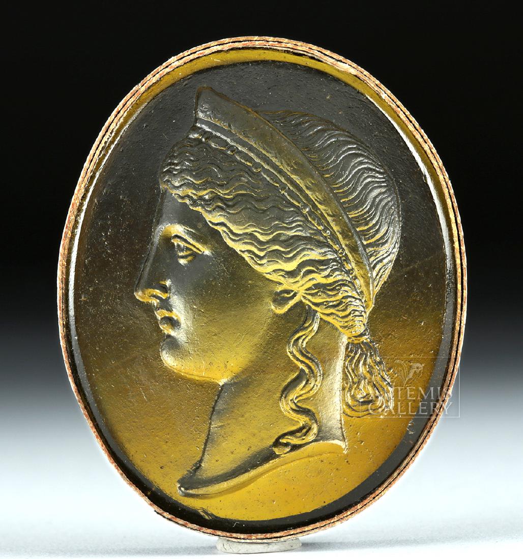 Neoclassical Glass Intaglio - Hera: Northern Europe, Neoclassical period, ca. 18th to 19th century CE. An attractive amber-hued glass intaglio depicting the head of a Classical figure in profile - perhaps Hera (Juno being Roman equivale