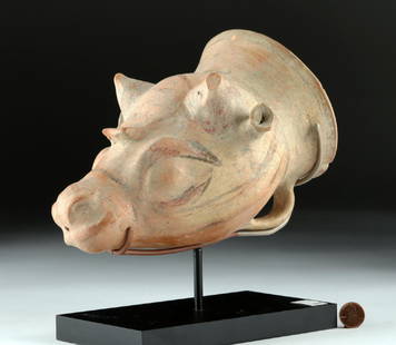 Published East Greek Phrygian Terracotta Bull Rhyton: East Greek, Phrygian, ca. 7th to 6th century BCE. A wonderful wheel-formed (note the fingermarks from pulling up the form on the wheel visible on the interior of the piece) and hand-modeled terracotta