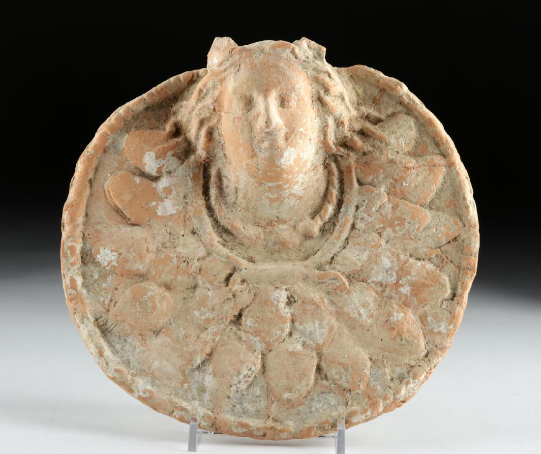Greek Terracotta Relief w/ Goddess: Ancient Greece, ca. 5th to 4th century BCE. A wonderful circular terracotta relief depicting the head of a goddess, perhaps Tyche (Roman counterpart being Fortuna) - the goddess of luck and fortune - 
