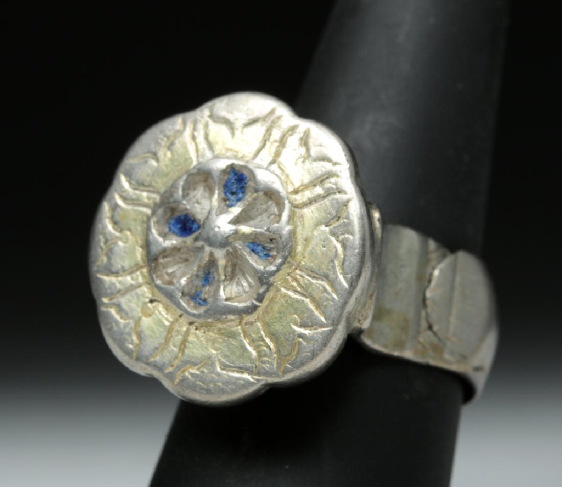 Beautiful Byzantine Gilded Silver Ring - 14.7 g: **Originally Listed At $250** Byzantium, ca. 6th to 12th century CE. A sizeable silver ring with a stunning floral face, the details incised, delineated in relief, and gilded - with traces of blue gla