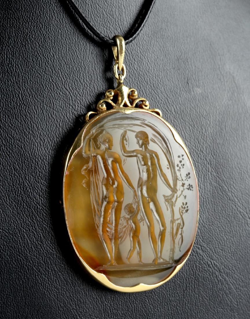 Victorian 16K Gold & Quartzite Intaglio Pendant: Europe, Victorian, ca. 19th century CE. An oval quartzite - possibly citrine - intaglio of translucent golden and amber hues incised with a nude depiction of Ares and Aphrodite, as well as their infan