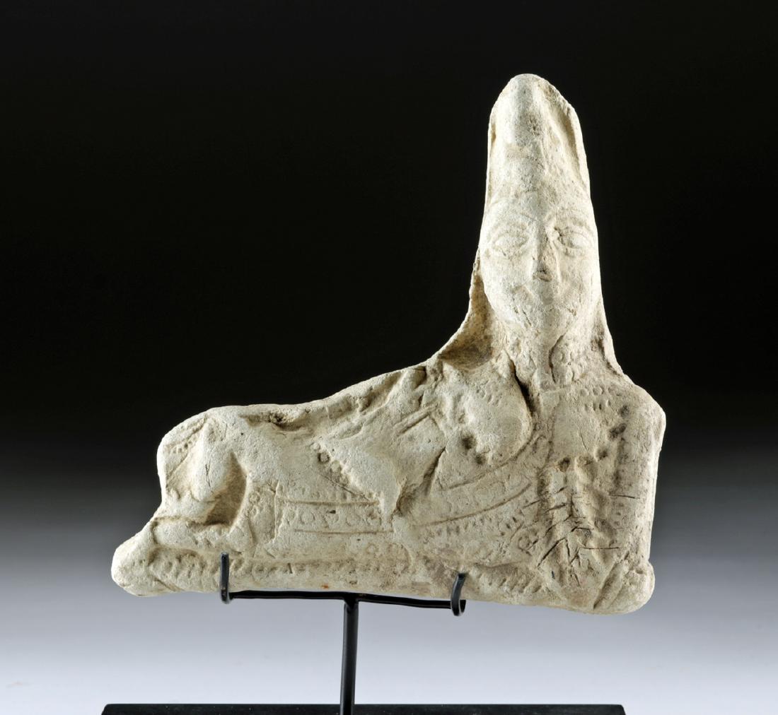 Early Etruscan Terracotta Banqueteer: **First Time At Auction** Classical world, Etruria, ca. 500 to 264 BCE, likely earlier in the period. A ceramic figure of a reclining woman at a banquet. The figure shows her sitting on a couch with o