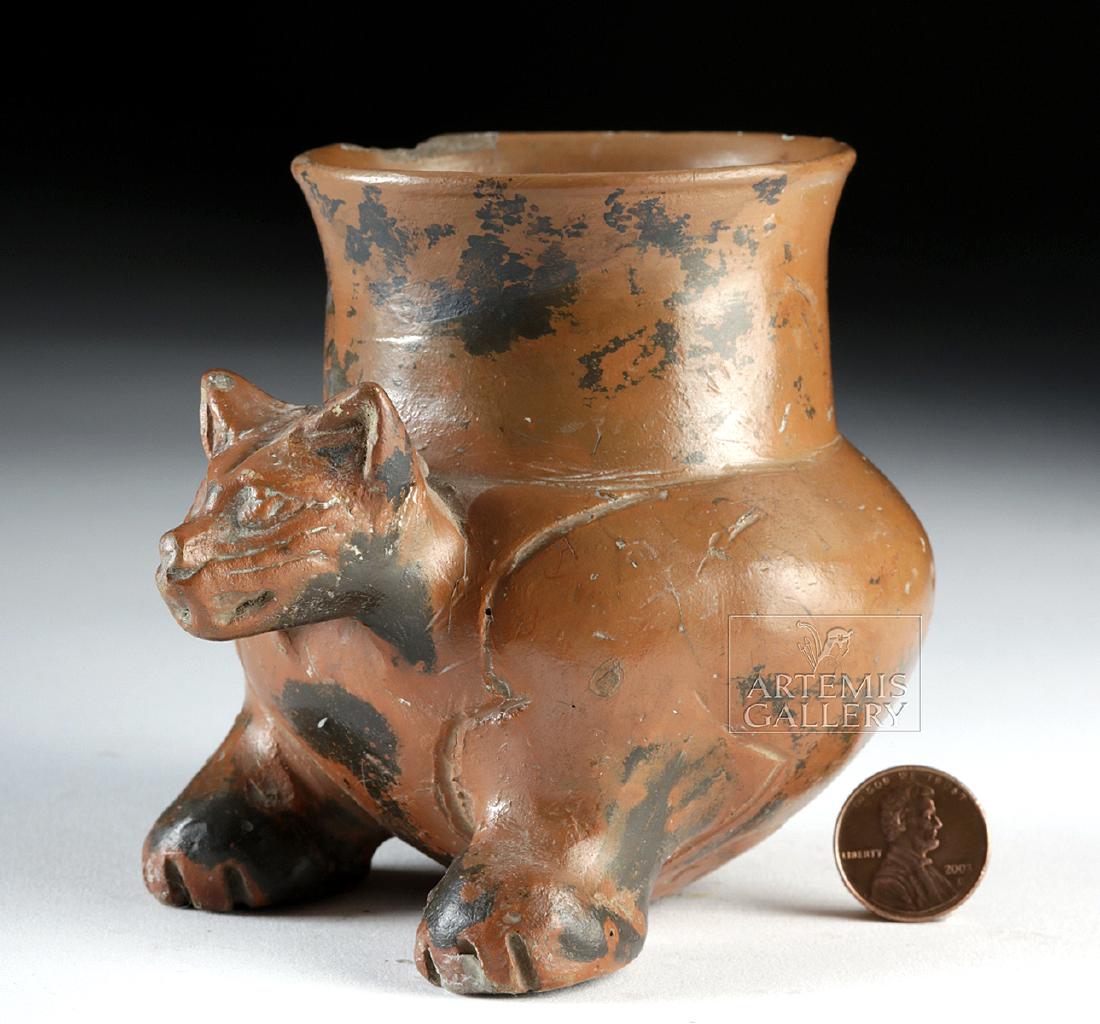 Adorable Maya Plumbate Pottery Jaguar Jar: Pre-Columbian, Mayan Territories, early Postclassic period, ca. 1000 to 1100 CE. A hand-built pottery jar with a petite circular base supported by two enormous front paws. The globular body has a tall