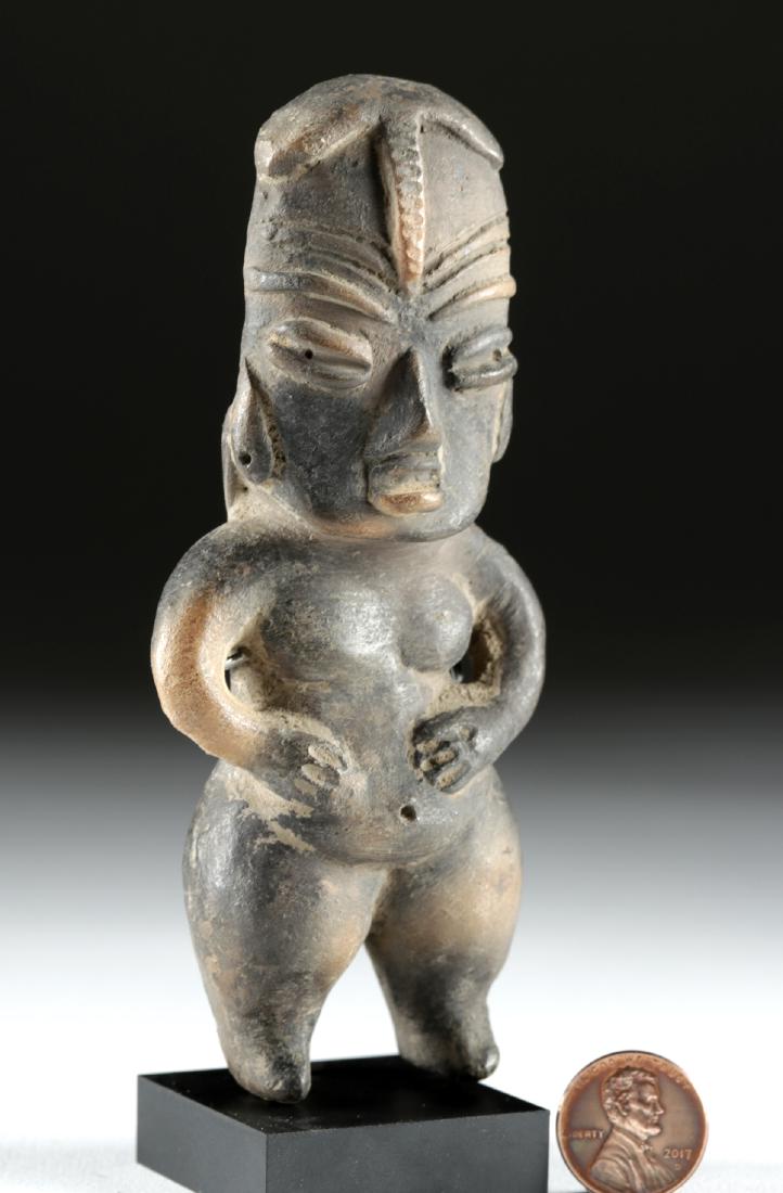 Fine Tlatilco Pottery Pretty Lady: Pre-Columbian, Valley of Mexico, Tlatilco, ca. early 1st millennium BCE. A tall, hand-built pottery standing figure with delineated legs, ample hips, perky breasts, sloping shoulders, and sinuous arms