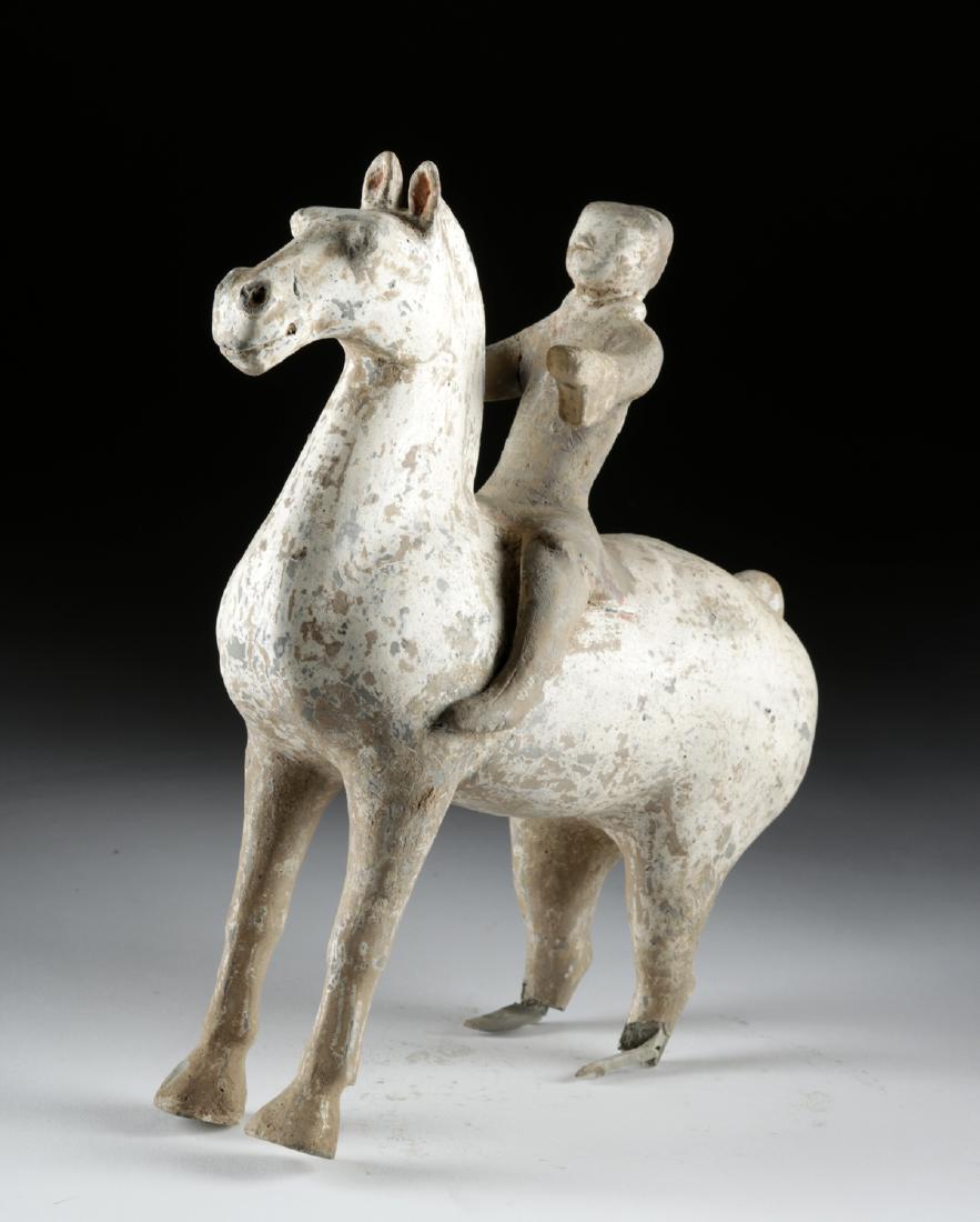Chinese Han Dynasty Pottery Horse and Rider, TL Tested: East Asia, China, Han Dynasty, ca. 206 BCE to 220 CE. A mold-made earthenware horse and rider, finely modeled and retaining areas of white, black, and red pigments. During the Han dynasty, the ancient