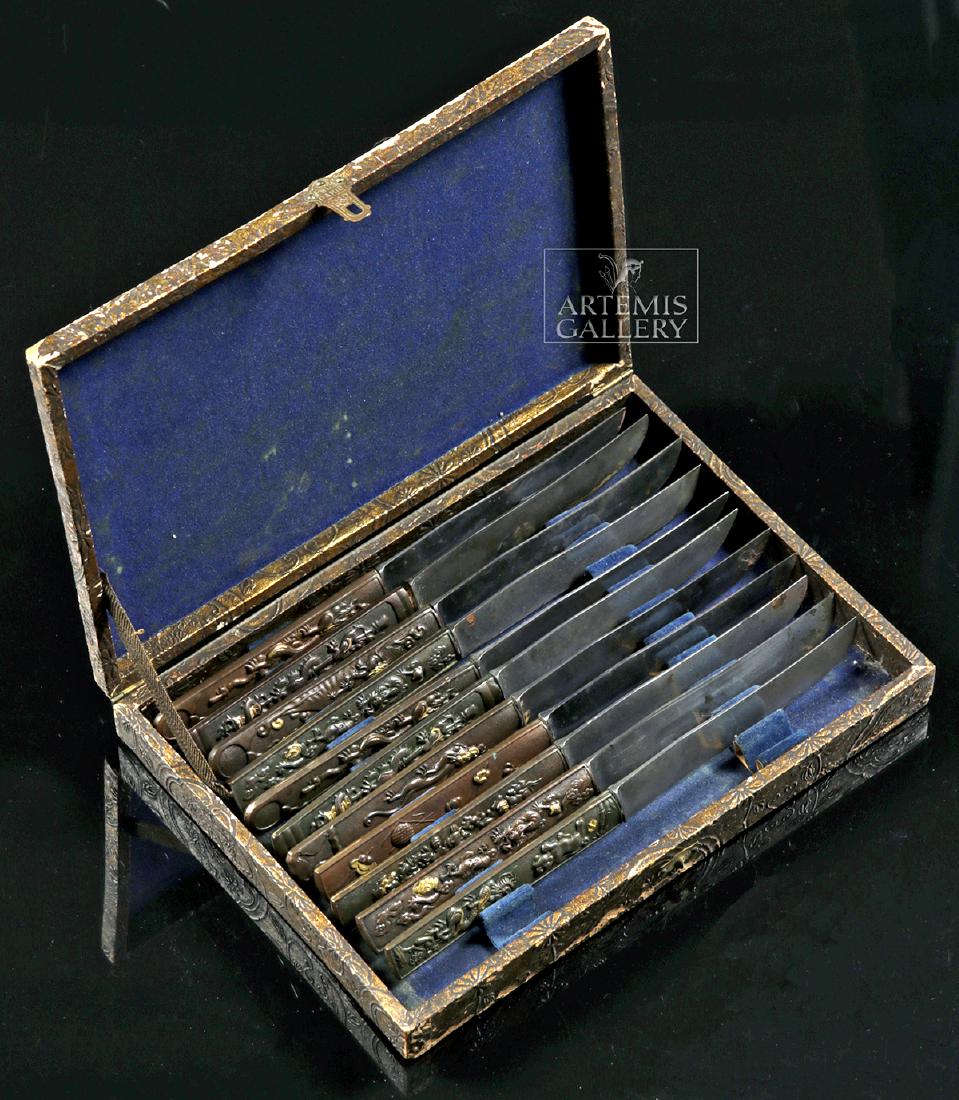 Lot of 11 Japanese Meiji Steel & Gilded Copper Kotagana: East Asia, Japan, Meiji Period, ca. 1868 to 1912 CE. A fine set of 11 carbon steel kotagana, small by-knives inserted within the folds of a wakizashi scabbard cord (sageo) used as an eating/cooking ut