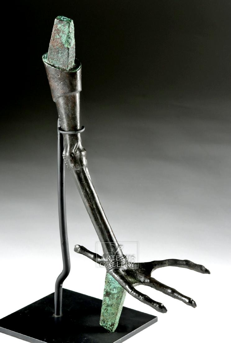 Egyptian Late Period Bronze Ibis Leg w/ Foot: Ancient Egypt, Late Period, ca. 712 to 300 BCE. A lifesize, cast bronze leg and foot from a bronze and wood model of an ibis, with heavy tabs for inserting it into a body and plinth at top and bottom 