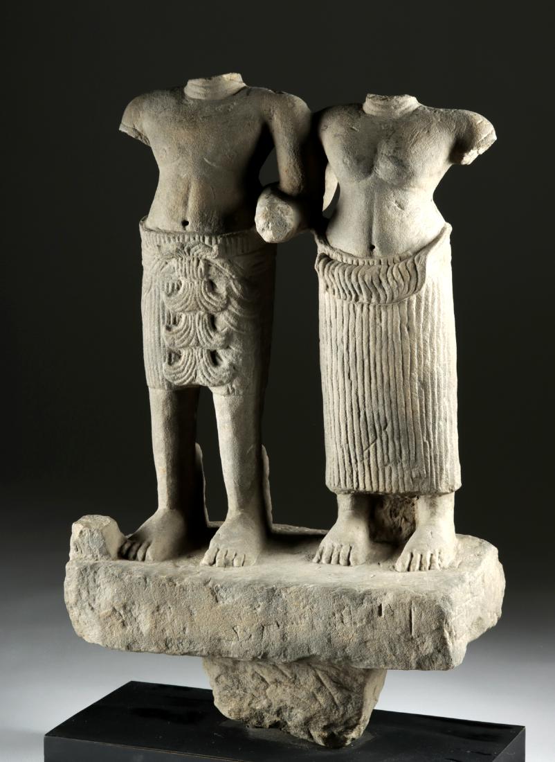 Cambodian Khmer Stone Sculpture - Shiva & Uma: Southeast Asia, Cambodia, Khmer Empire (Angkor culture), ca. 12th century CE. A buff grey sandstone statue of a male and female pair with finely carved figures and clothing. The couple stand side by s