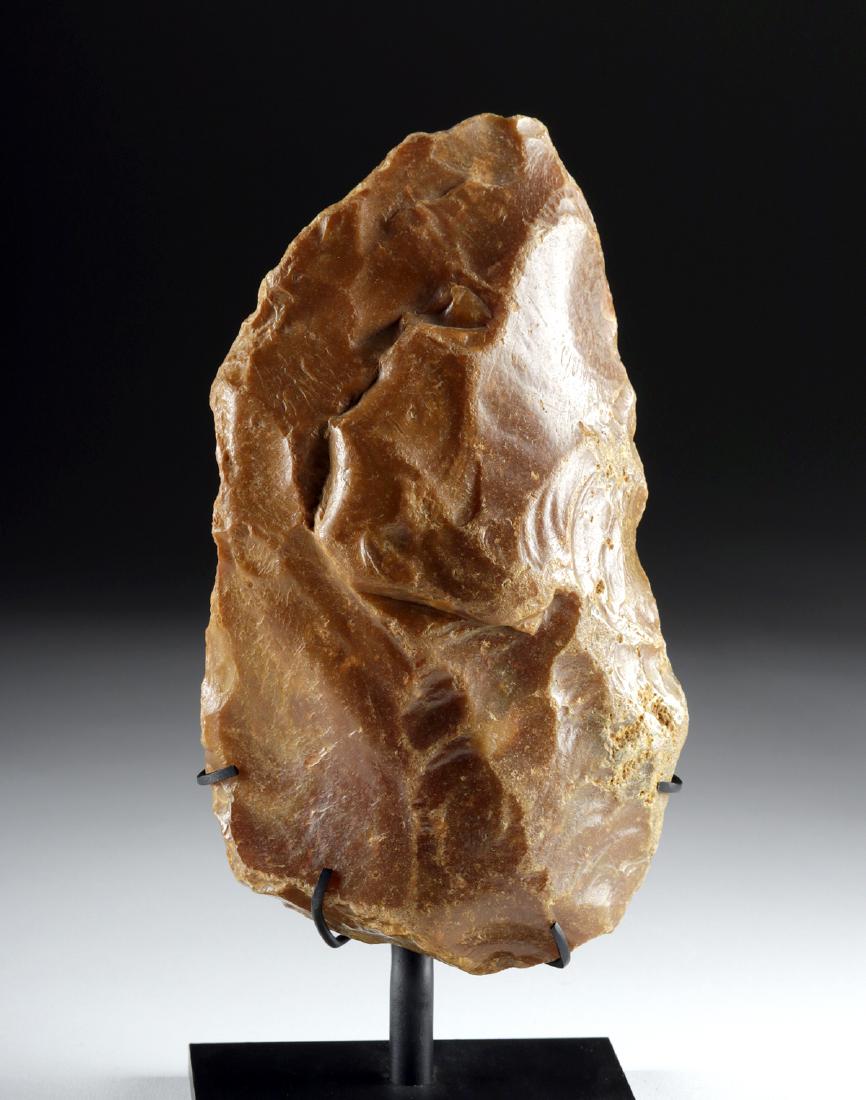 Large 250,000+ Year Old Paleolithic Stone Hand Axe: Old World, Acheulean tradition, found in LeGrand-Pressigny, France , ca. 450,000 to 250,000 years ago. A fine, large example of an Acheulean hand axe in the characteristic ovoid/pear shape, knapped fr