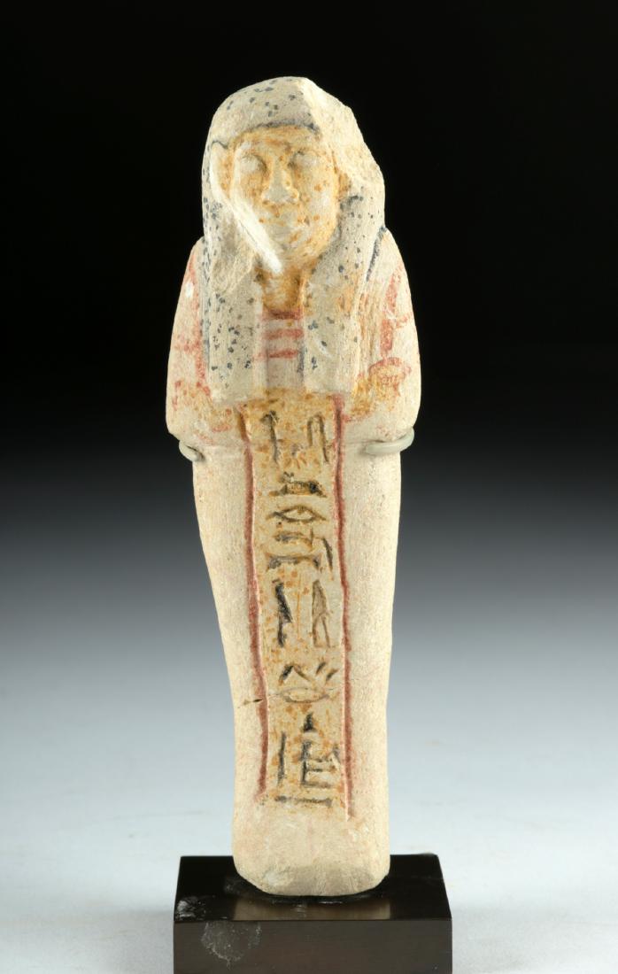 Rare / Fine Egyptian Polychrome Limestone Ushabti: Ancient Egypt, New Kingdom, Ramesside Period, 19th to 20th Dynasty, ca. 1292 to 1070 BCE. A beautiful, hand-carved limestone ushabti displaying a myriad of fine details. The figure stands in mummiform