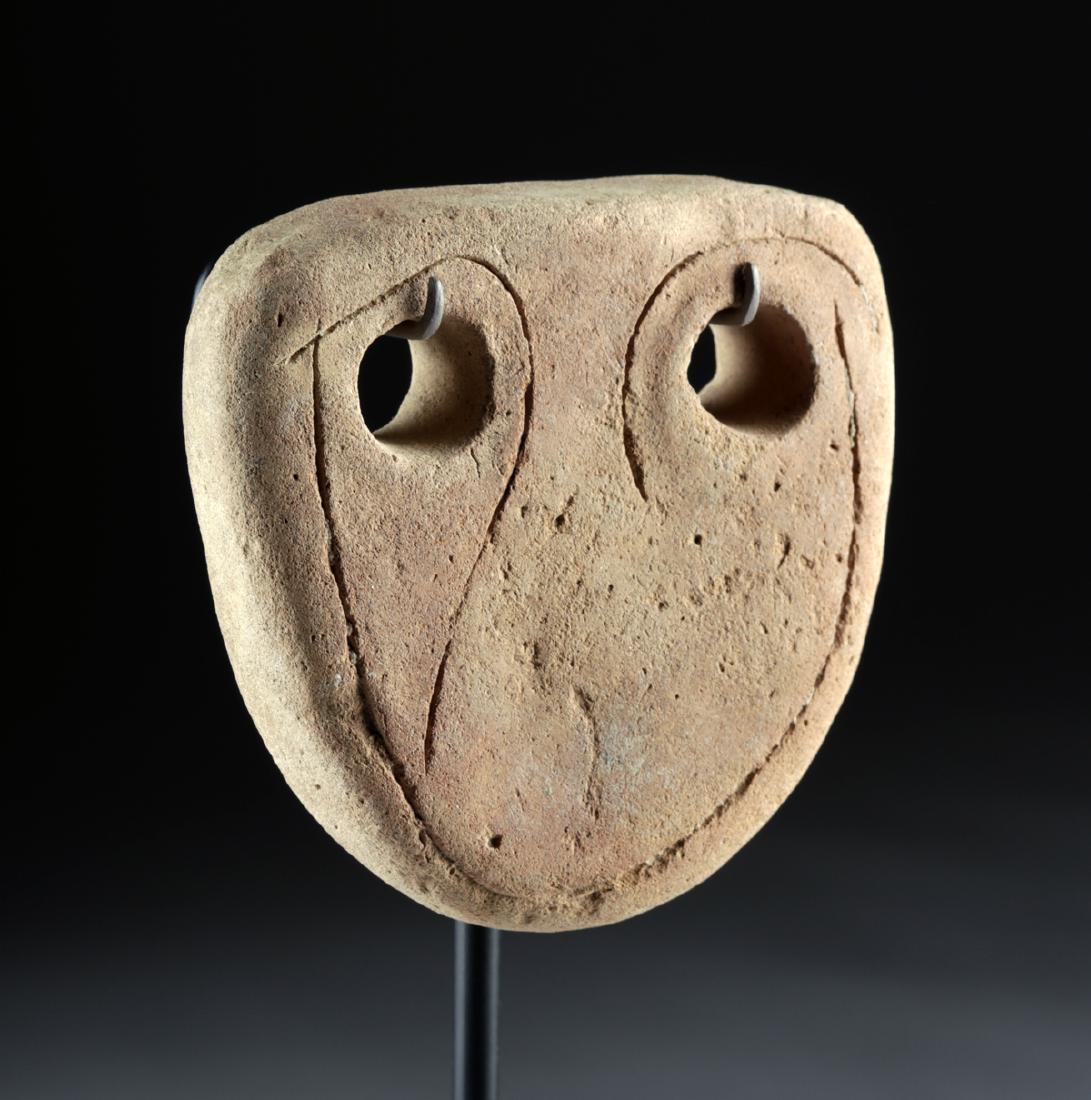 Ancient Near Eastern Terracotta Eye Idol w/ TL: Ancient Near East, Syria, ca. late 3rd to early 2nd millennium BCE. An interesting terracotta idol with a roughly-triangular body, rounded peripheries, and a pair of pierced "eyes" surrounded by thinl
