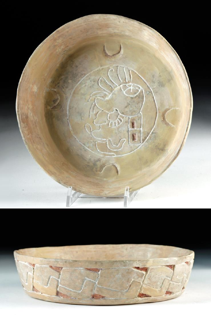 Rare Maya Carved Pottery Dish: Pre-Columbian, Mexico and northern Central America, Maya Territories, Late Classic, ca. 550 to 900 CE. A shallow ceramic bowl with gently flaring, steep-walled sides, and a large, flat base. The sides