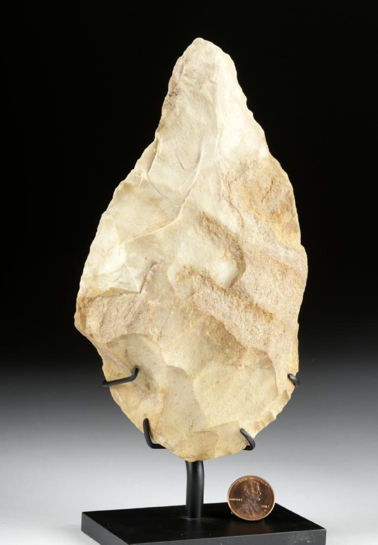 French Mousterian Neanderthal Biface Chert Hand Axe: Europe, France, Bergerac region, Mousterian Period, ca. 120,000 to 40,000 years old. A handsome pale beige chert biface, a stone tool made by Homo neanderthalensis, used as a hand axe. The tool is siz