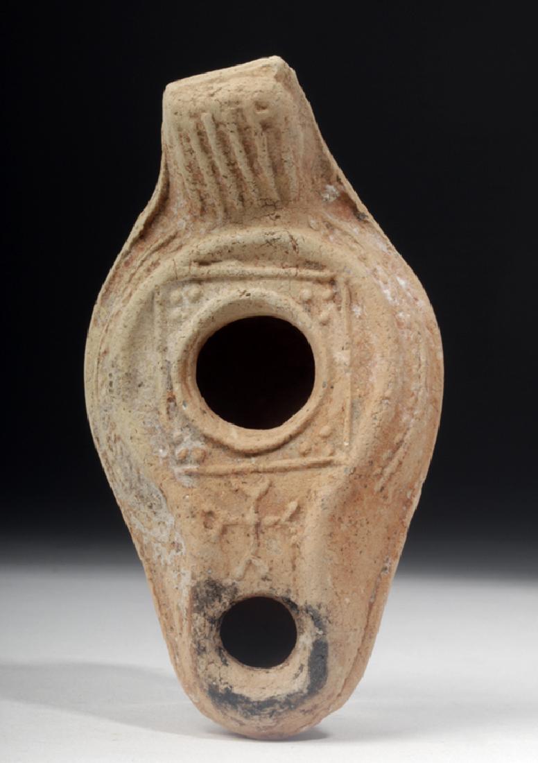 Byzantine Pottery Oil Lamp - Crucifix Motif: **Originally Listed At $100** Byzantine Empire, ca. 6th to 7th century CE. This elegant terracotta vessel features a large raised ring base with a smaller concentric ring surrounding it, smooth and ro