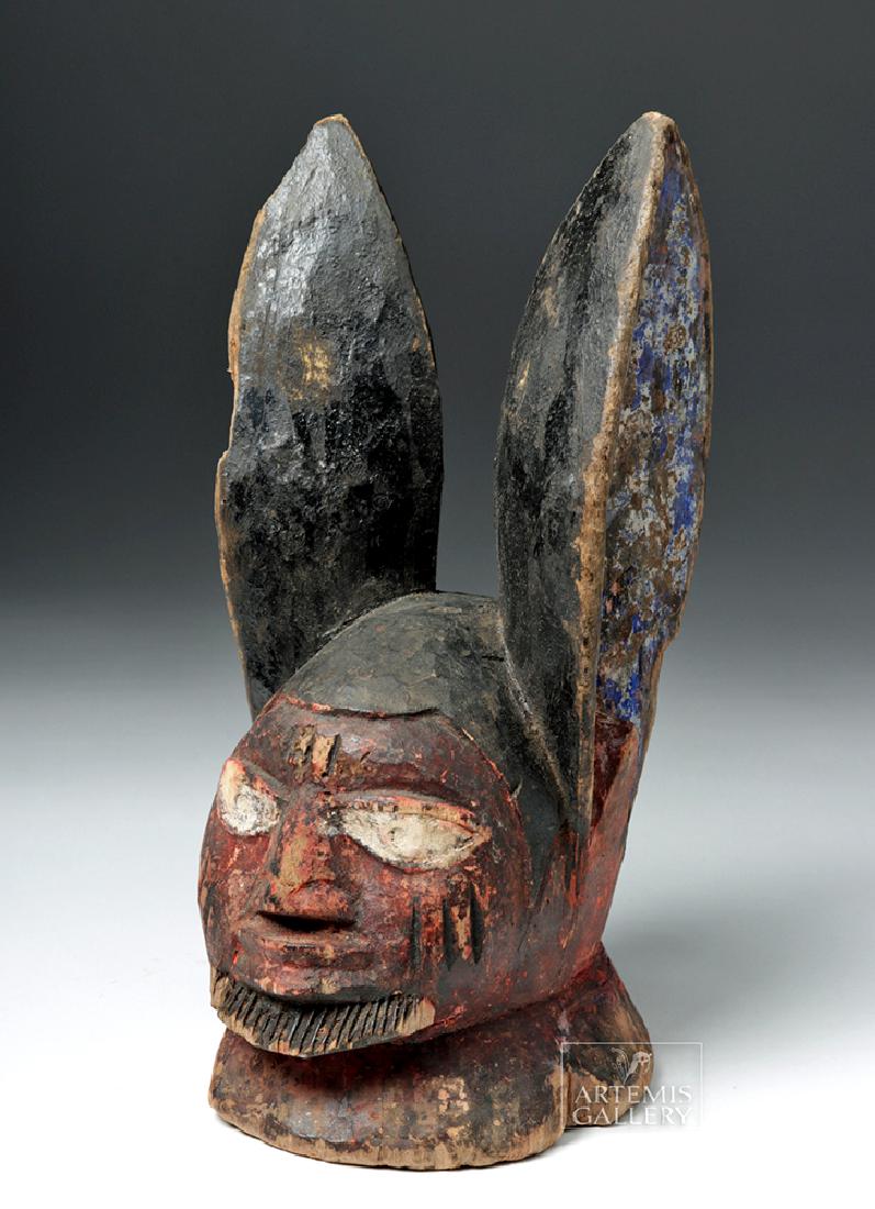 Mid 20th C. African Yoruban Wood Egungun Mask: **Originally Listed At $200** Africa, Nigeria, Yoruba, ca. mid 20th century CE. A hand-carved and painted Egungun headdress depicting a bearded visage with very high pointed rabbit-like ears. Egungun 