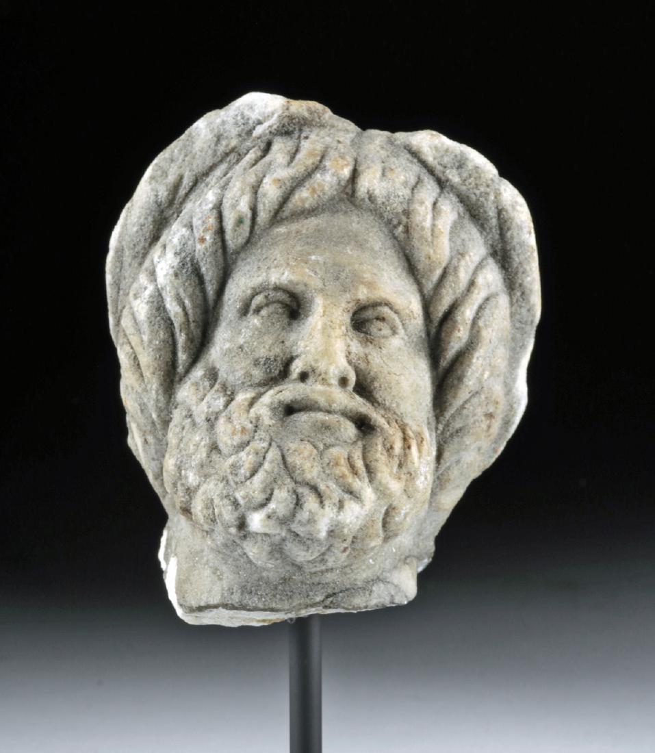 Roman Limestone Head of a Male - Jupiter / Zeus: Roman, Imperial Period, ca. 1st to 3rd century CE. A finely sculpted limestone bust of a bearded male - perhaps the god Jupiter (Zeus). The mature god has an oval face with well-delineated features in