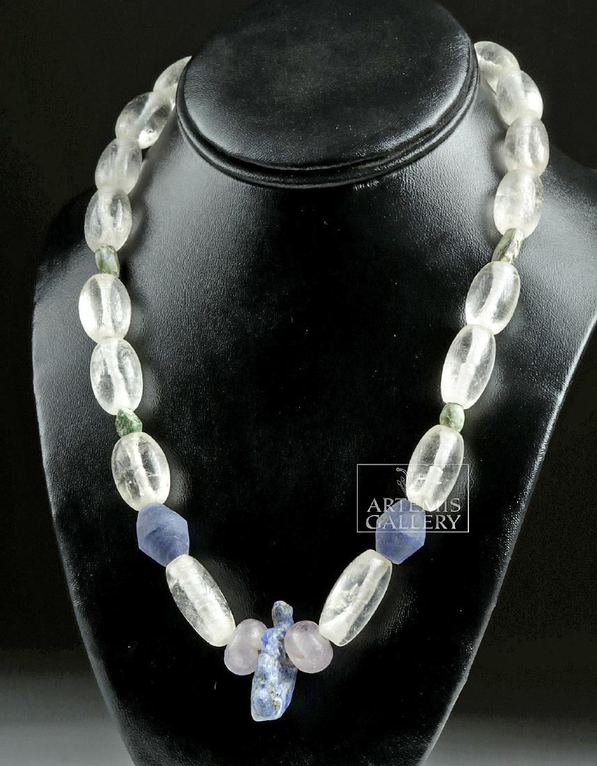 Peruvian Sodalite, Amethyst, Quartz Necklace: Pre-Columbian, Peru, Chavin and Moche, ca. 500 BCE to 500 CE. A grand necklace with beads carved from sodalite, one of the primary elements of lapis lazuli mined from the Andes and cherished since ant