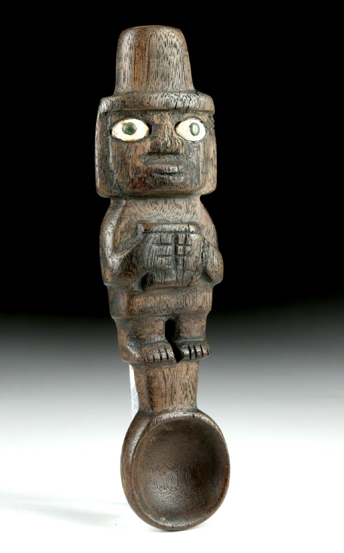 Rare Huari Wood Drug Spoon w/ Shell & Stone Inlay: Pre-Columbian, Huari/Wari culture, Peru, ca. 6th to 9th century CE. A ritual spoon carved from dark wood, in excellent condition for a wood item of this age. The handle is in the form of a standing lo