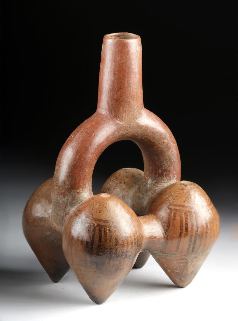 Inca Redware Stirrup Vessel - Cacao Pods w/ Decoration: Pre-Columbian, North Coast Peru, Inca culture, ca. 1200 to 1400 CE. A lovely hand-built and highly burnished redware stirrup vessel - its form with four cacao pods connected via tubular passageways an