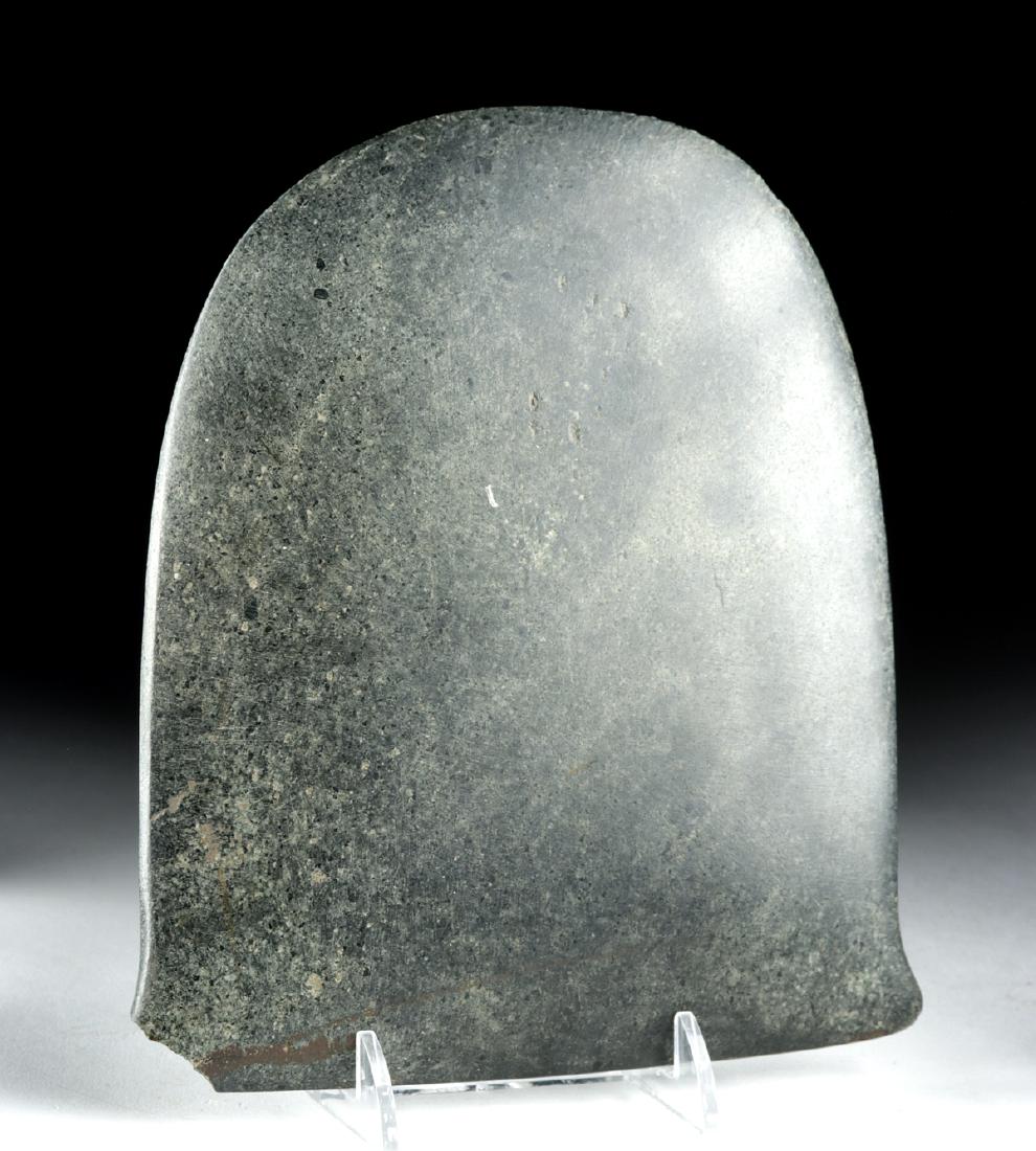 Large Museum Exhibited Valdivian Greenstone Broad Axe: Pre-Columbian, Ecuador, Valdivian/Shillacoto-Wairajirca culture, ca. 1800 to 1500 BCE. A beautiful broad axe head of a substantial form with concave sides, a rounded blade edge, and a pair of miniscul