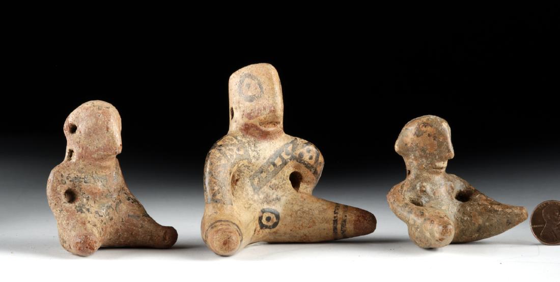 Lot of 3 Costa Rican Nicoya Polychrome Seated Figures: Pre-Columbian, Central America, Costa Rica, Nicoya region, ca. 1000 CE. A charming set of three hand-built pottery figurines shown in seated poses. The smallest has a petite mouth and pointed ears. Th