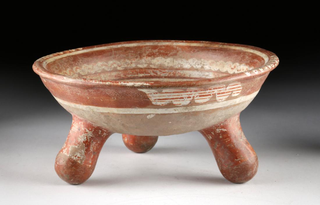 Michoacan Polychrome Tripod Grater Bowl w/ Rattle Feet: Pre-Columbian, West Mexico, Michoacan area, ca. 1350 to 1521 CE. A hand-built and highly-burnished pottery bowl with a wide basin, tall walls, and a flared rim, all atop a trio of hollow nubbin legs.